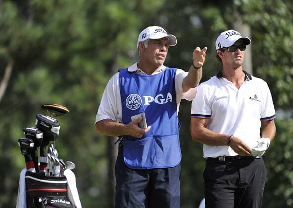 Adam Scott (R) of Australia talks to his caddie Steve Williams on the 17th tee during the second round of the 93rd PGA Golf Herren Championship at the Atlanta Athletic Club on August 12, 2011 in Johns Creek, Georgia.  BKX2011081283