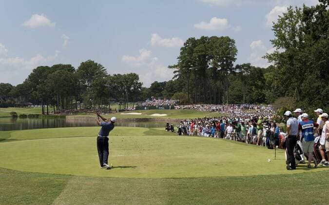 Tiger Woods tees off on the 4th hole during the second round of the 93rd PGA Golf Herren Championship at the Atlanta Athletic Club on August 12, 2011 in Johns Creek, Georgia.  BKX2011081275