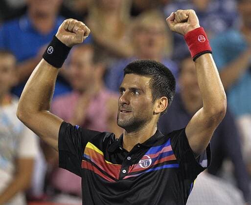 Aug. 12, 2011 - Canada - MONTREAL, QUE.: AUGUST 12, 2011 -- Novak Djokovic raises his arms in victory following his match at the Rogers Cup tennis tournament in Montreal August 12, 2011. Canadian News - Aug. 12, 2011 - ZUMAw51