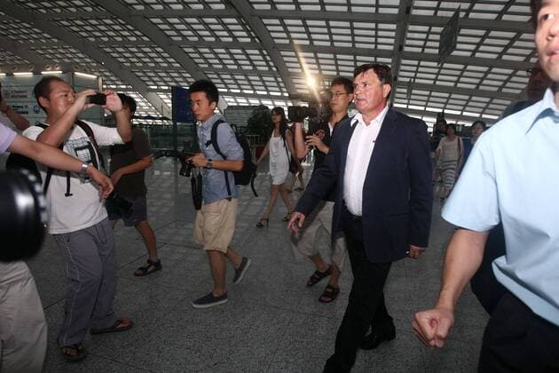 Aug 13, 2011; Beijing, CHINA; Jose Antonio Camacho of Spain arrived in Beijing on Saturday morning for his new post as coach of the Chinese national soccer team. Surrounded by flashlights from local media at the Beijing Capital International Airport, the 56-year-old kept a prudential profile and reclined to elaborate on his future plan for the team. Soccer 2011: Chinese National Soccer Team AUG 13  - ZUMAc10