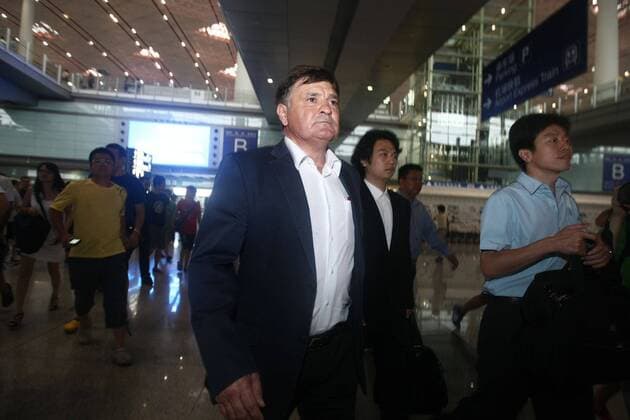 Aug 13, 2011; Beijing, CHINA; Jose Antonio Camacho of Spain arrived in Beijing on Saturday morning for his new post as coach of the Chinese national soccer team. Surrounded by flashlights from local media at the Beijing Capital International Airport, the 56-year-old kept a prudential profile and reclined to elaborate on his future plan for the team. Soccer 2011: Chinese National Soccer Team AUG 13  - ZUMAc10