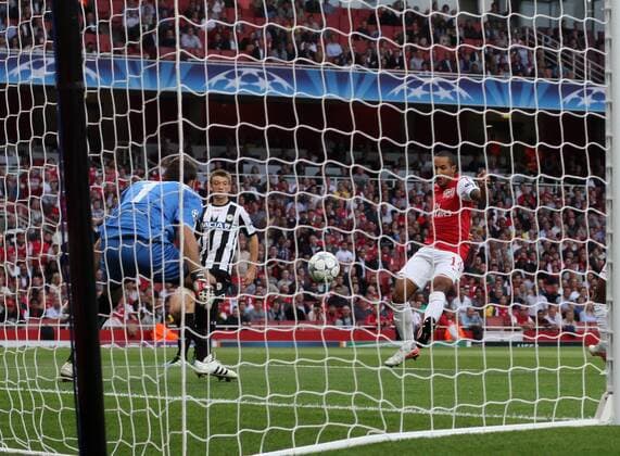 Arsneals Theo Walcott scoring his sides opening goal UEFA Champions League Qualifying Arsenal FC London v Udinese Calcio 16th August, 2011 EDITORIAL USE ONLY. No use with unauthorised audio, video, data, fixture lists, club league logos or live services. Online in-match use limited to 120 images, no video emulation. No use in betting, games or single club league player publications.
