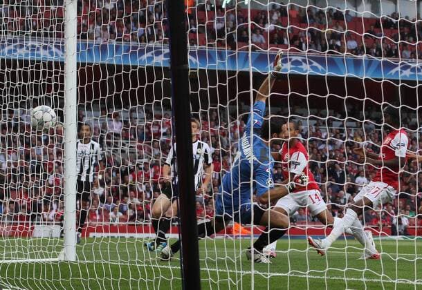 Arsneals Theo Walcott scoring his sides opening goal UEFA Champions League Qualifying Arsenal FC London v Udinese Calcio 16th August, 2011 EDITORIAL USE ONLY. No use with unauthorised audio, video, data, fixture lists, club league logos or live services. Online in-match use limited to 120 images, no video emulation. No use in betting, games or single club league player publications.