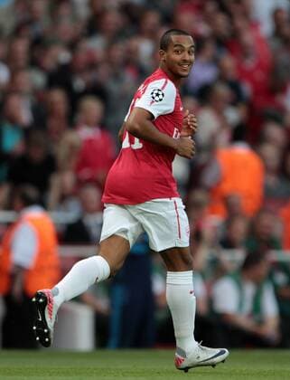 Arsneals Theo Walcott celebrates scoring his sides opening goal UEFA Champions League Qualifying Arsenal FC London v Udinese Calcio 16th August, 2011 EDITORIAL USE ONLY. No use with unauthorised audio, video, data, fixture lists, club league logos or live services. Online in-match use limited to 120 images, no video emulation. No use in betting, games or single club league player publications.