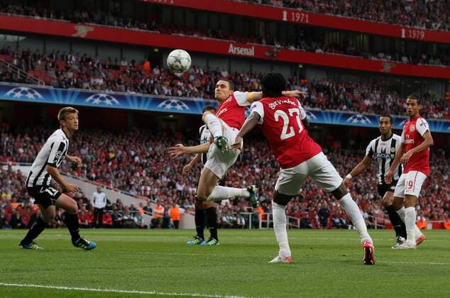 Arsneals Thomas Vermaelen has a shot on target UEFA Champions League Qualifying Arsenal FC London v Udinese Calcio 16th August, 2011 EDITORIAL USE ONLY. No use with unauthorised audio, video, data, fixture lists, club league logos or live services. Online in-match use limited to 120 images, no video emulation. No use in betting, games or single club league player publications.