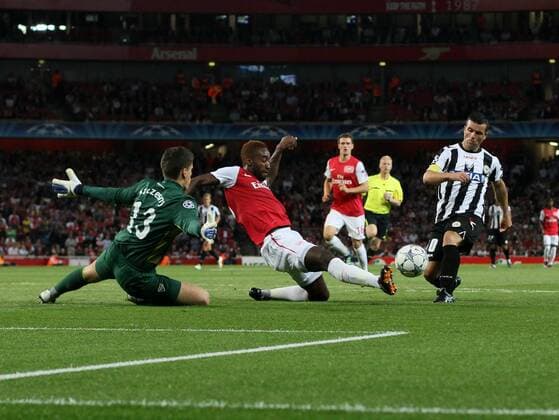 Arsneals Johan Djourou makes a superb block from Udineses Antonio Di Natale UEFA Champions League Qualifying Arsenal FC London v Udinese Calcio 16th August, 2011 EDITORIAL USE ONLY. No use with unauthorised audio, video, data, fixture lists, club league logos or live services. Online in-match use limited to 120 images, no video emulation. No use in betting, games or single club league player publications.