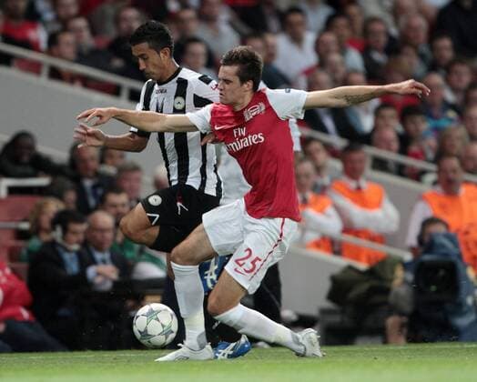 Arsenals Carl Jenkinson tussles with Udineses Giampero Pinzi UEFA Champions League Qualifying Arsenal FC London vs Udinese Calcio 16th August, 2011 EDITORIAL USE ONLY. No use with unauthorised audio, video, data, fixture lists, club league logos or live services. Online in-match use limited to 120 images, no video emulation. No use in betting, games or single club league player publications.