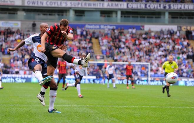 Edin Dzeko of Manchester City scores the third goal Barclays Premier League. Bolton Wanderers vs Manchester City. 21st August, 2011 EDITORIAL USE ONLY. No use with unauthorised audio, video, data, fixture lists, club league logos or live services. Online in-match use limited to 120 images, no video emulation. No use in betting, games or single club league player publications.