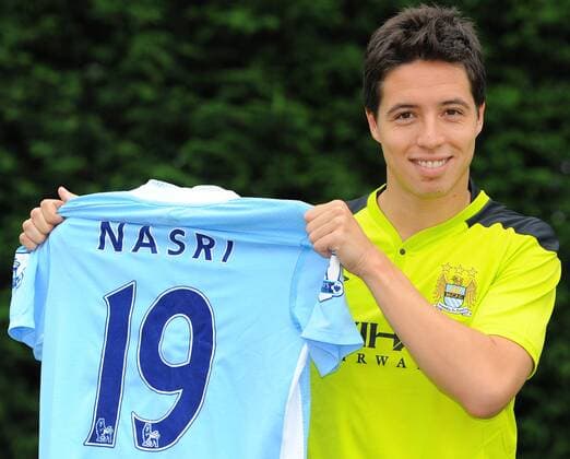 Manchester City s new signing French midfielder Samir Nasri poses for photographers at the clubs Carrington training ground, in Manchester on August 26, 2011 Player Signing Player Signing - Manchester City 26th August, 2011 EDITORIAL USE ONLY. No use with unauthorised audio, video, data, fixture lists, club league logos or live services. Online in-match use limited to 120 images, no video emulation. No use in betting, games or single club league player publications.