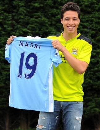 Manchester City s new signing French midfielder Samir Nasri poses for photographers at the clubs Carrington training ground, in Manchester on August 26, 2011 Player Signing Player Signing - Manchester City 26th August, 2011 EDITORIAL USE ONLY. No use with unauthorised audio, video, data, fixture lists, club league logos or live services. Online in-match use limited to 120 images, no video emulation. No use in betting, games or single club league player publications.
