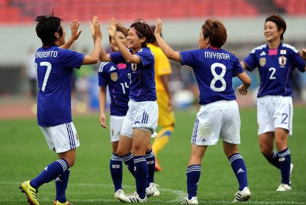 (110901) -- JINAN, Sept. 1, 2011-- Players of Japan celebrate during a qualifying match of 2012 Olympic women football tournament in Jinan, capital of Shandong province Sept. 1, 2011. Japan beat Thailand 3-0. 