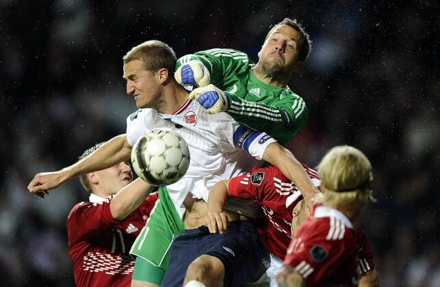 Soccer National Team EURO Qualification match, Denmark - Norway: Brede Hangeland, Norge. Keeper Thomas Sörensen, Danmark. 