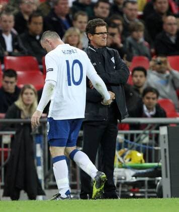 Englands Wayne Rooney shakes hands with Fabio Capello European Championship Qualifying Group G England v Wales 6th September, 2011 EDITORIAL USE ONLY. No use with unauthorised audio, video, data, fixture lists, club league logos or live services. Online in-match use limited to 120 images, no video emulation. No use in betting, games or single club league player publications.