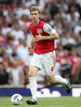 Arsenals Per Mertesacker in action Barclays Premier League Arsenal FC v Swansea City 10th September, 2011 EDITORIAL USE ONLY. No use with unauthorised audio, video, data, fixture lists, club league logos or live services. Online in-match use limited to 120 images, no video emulation. No use in betting, games or single club league player publications.