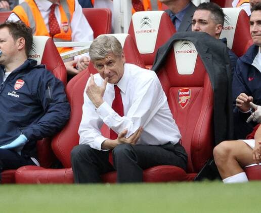 Arsenals Arsene Wenger looks on Barclays Premier League Arsenal FC v Swansea City 10th September, 2011 EDITORIAL USE ONLY. No use with unauthorised audio, video, data, fixture lists, club league logos or live services. Online in-match use limited to 120 images, no video emulation. No use in betting, games or single club league player publications.