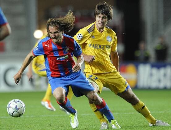 Aliaksandr Pavlov from BATE Borisov, left, and Frantisek Rajtoral from FC Viktoria Plzen during the Champions League group H soccer match in Prague, Tuesday, Sep. 13, 2011. (CTKxPhoto MichalxKamaryt)  CTKPhoto7201109131002701