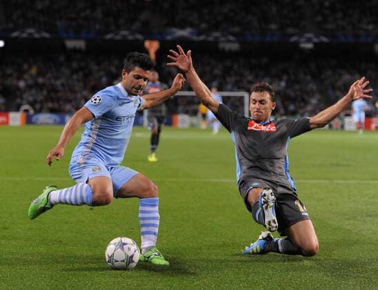 Sergio Kun Aguero of Manchester City tussles with Hugo Campagnaro of SSC Napoli UEFA Champions League Group A Manchester City v Napoli 14th September, 2011 EDITORIAL USE ONLY. No use with unauthorised audio, video, data, fixture lists, club league logos or live services. Online in-match use limited to 120 images, no video emulation. No use in betting, games or single club league player publications.