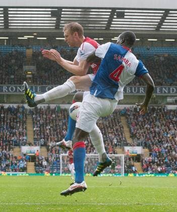 Per Mertesacker of Arsenal challenges Christopher Samba of Blackburn Rovers Barclays Premier League - Blackburn Rovers vs. Arsenal FC London - 17th September, 2011 EDITORIAL USE ONLY. No use with unauthorised audio, video, data, fixture lists, club league logos or live services. Online in-match use limited to 120 images, no video emulation. No use in betting, games or single club league player publications.