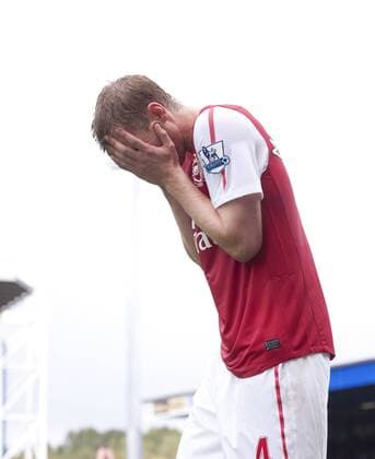Per Mertesacker of Arsenal dejected after missing with a header Barclays Premier League - Blackburn Rovers vs. Arsenal FC London - 17th September, 2011 EDITORIAL USE ONLY. No use with unauthorised audio, video, data, fixture lists, club league logos or live services. Online in-match use limited to 120 images, no video emulation. No use in betting, games or single club league player publications.