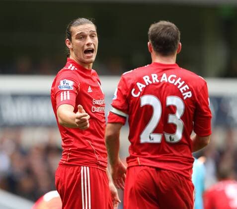 Liverpools Andy Carroll has word with Jamie Carragher Barclays Premier League - Tottenham Hotspur v Liverpool FC - EDITORIAL USE ONLY. No use with unauthorised audio, video, data, fixture lists, club league logos or live services. Online in-match use limited to 120 images, no video emulation. No use in betting, games or single club league player publications.