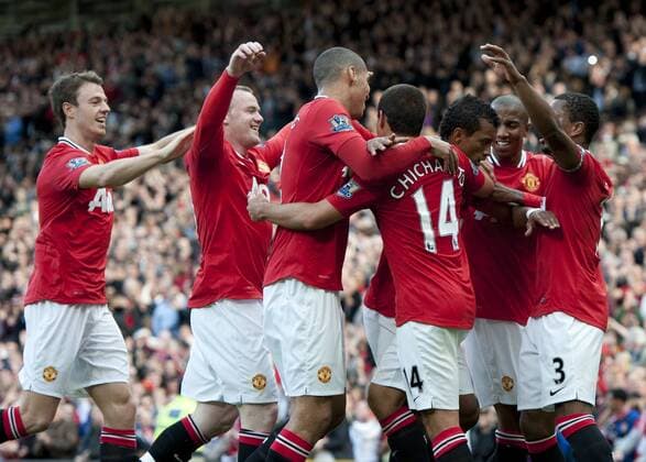 Nani of Manchester United is mobbed as he celebrates scoring the second goal Barclays Premier League - Manchester United (ManU) - Chelsea FC London - EDITORIAL USE ONLY. No use with unauthorised audio, video, data, fixture lists, club league logos or live services. Online in-match use limited to 120 images, no video emulation. No use in betting, games or single club league player publications.