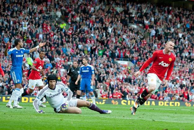 Wayne Rooney of Manchester United turns to celebrate scoring the third goal past Petr Cech of Chelsea Barclays Premier League - Manchester United (ManU) - Chelsea FC London - EDITORIAL USE ONLY. No use with unauthorised audio, video, data, fixture lists, club league logos or live services. Online in-match use limited to 120 images, no video emulation. No use in betting, games or single club league player publications.