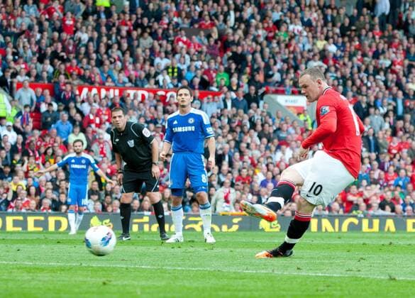 Wayne Rooney of Manchester United scores the third goal past Petr Cech of Chelsea Barclays Premier League - Manchester United (ManU) - Chelsea FC London - EDITORIAL USE ONLY. No use with unauthorised audio, video, data, fixture lists, club league logos or live services. Online in-match use limited to 120 images, no video emulation. No use in betting, games or single club league player publications.