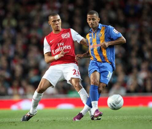 Arsenals Kieran Gibbs tussles with Shrewsburys Lionel Ainsworth Carling Cup - Arsenal FC London vs. Shrewsbury Town - 20th September, 2011 EDITORIAL USE ONLY. No use with unauthorised audio, video, data, fixture lists, club league logos or live services. Online in-match use limited to 120 images, no video emulation. No use in betting, games or single club league player publications.