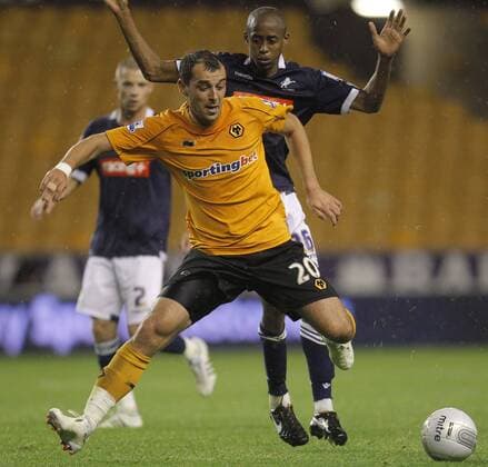 Nenad Milijas of Wolverhampton Wanderers is chased by Millwall defender Jimmy Abdou Carling Cup Wolverhampton Wanderers v Millwall 20th September, 2011 EDITORIAL USE ONLY. No use with unauthorised audio, video, data, fixture lists, club league logos or live services. Online in-match use limited to 120 images, no video emulation. No use in betting, games or single club league player publications.