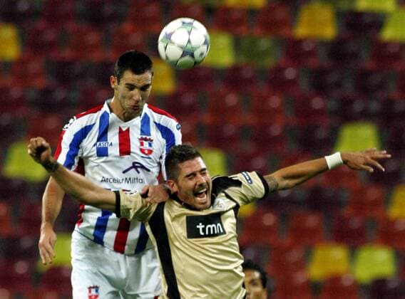27.09.2011 Bucharest(Romania) FC Otelul Galati-SL Benfica Champions League Group C men s football Bratislav Punosevac(L) FC Otelul Galati and Javi Garcia(R) SL Benfica : 