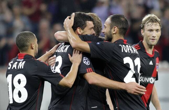 Leverkusen s Michael BALLACK (M) celebrates scoring the 2:0 with teammates Ömer Toprak (R) and Sidney Sam during the Championsleague match between Bayer 04 Leverkusen and KRC Genk, Bayarena in Leverkusen on September 28., 2011. Bayer 04 Leverkusen gegen KRC Genk am 2. Spieltag der Championsleague in der Saison 2011 2012 am 28. September 2011.