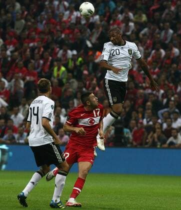 2012 Europe Cup group match beetwen Turkey ( red) and Germany ( white ) at Turk Telekom Arena Stadium in Istanbul,Turkey on October 07, 2011. Pictured: Burak Yilmaz of Turkey and Jerome Boateng of Germany.  Euro