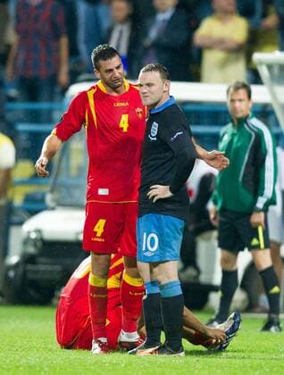 Milan Jovanovic of Montenegro argues with Wayne Rooney of England after his red card challenge European Championship Qualifying Group G Montenegro v England 7th October, 2011 EDITORIAL USE ONLY. No use with unauthorised audio, video, data, fixture lists, club league logos or live services. Online in-match use limited to 120 images, no video emulation. No use in betting, games or single club league player publications. Euro