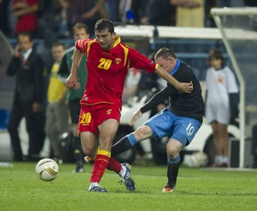Wayne Rooney of England kicks out at Miodrag Dzudovic of Montenegro which leads to his red card European Championship Qualifying Group G Montenegro v England 7th October, 2011 EDITORIAL USE ONLY. No use with unauthorised audio, video, data, fixture lists, club league logos or live services. Online in-match use limited to 120 images, no video emulation. No use in betting, games or single club league player publications. Euro