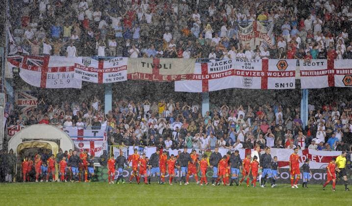 England and Montenegro teams walk out in the torrential rain European Championship Qualifying Group G Montenegro v England 7th October, 2011 EDITORIAL USE ONLY. No use with unauthorised audio, video, data, fixture lists, club league logos or live services. Online in-match use limited to 120 images, no video emulation. No use in betting, games or single club league player publications. o0 Fans Totale o00 Euro