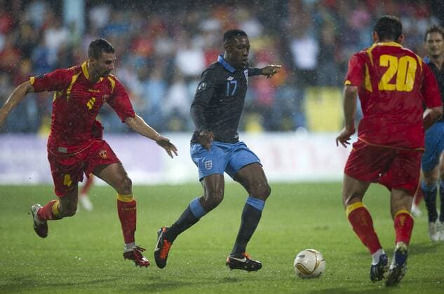 Danny Welbeck of England avoids Milan Jovanovic of Montenegro European Championship Qualifying Group G Montenegro v England 7th October, 2011 EDITORIAL USE ONLY. No use with unauthorised audio, video, data, fixture lists, club league logos or live services. Online in-match use limited to 120 images, no video emulation. No use in betting, games or single club league player publications. o00 Euro