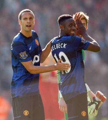 Manchester United s Rio Ferdinand points to the number 19 on Danny Welbeck s back referring to the amount of titles won by Manchester United Barclays Premier League Liverpool v Manchester United 15th October, 2011 EDITORIAL USE ONLY. No use with unauthorised audio, video, data, fixture lists, club league logos or live services. Online in-match use limited to 120 images, no video emulation. No use in betting, games or single club league player publications.