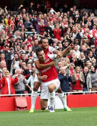 Arsenals Robin Van Persie celebrates scoring his sides opening goal with Theo Walcott Barclays Premier League Arsenal v Sunderland 16th October, 2011 EDITORIAL USE ONLY. No use with unauthorised audio, video, data, fixture lists, club league logos or live services. Online in-match use limited to 120 images, no video emulation. No use in betting, games or single club league player publications.