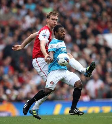 Arsenals Per Mertesacker tussles with Sunderlands Stephane Sessegnon Barclays Premier League Arsenal v Sunderland 16th October, 2011 EDITORIAL USE ONLY. No use with unauthorised audio, video, data, fixture lists, club league logos or live services. Online in-match use limited to 120 images, no video emulation. No use in betting, games or single club league player publications.