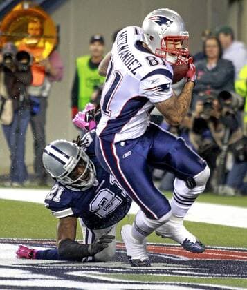 Oct. 16, 2011 - Foxborough, Massachusetts, U.S. - Dallas Cowboys cornerback MIKE JENKINS (21) can t stop New England Patriots tight end AARON HERNANDEZ (81) from making a last minute touchdown catch. The New England Patriots defeated the Dallas Cowboys, 20-16, at Gillette Stadium. NFL American Football Herren USA 2011 - New England Patriots Beat Dallas Cowboys 20-16 - ZUMAm67