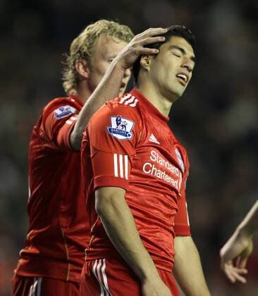 Liverpools Luis Suarez looks on dejected after missing another chance Barclays Premier League Liverpool v Norwich City 22nd October, 2011 EDITORIAL USE ONLY. No use with unauthorised audio, video, data, fixture lists, club league logos or live services. Online in-match use limited to 120 images, no video emulation. No use in betting, games or single club league player publications.
