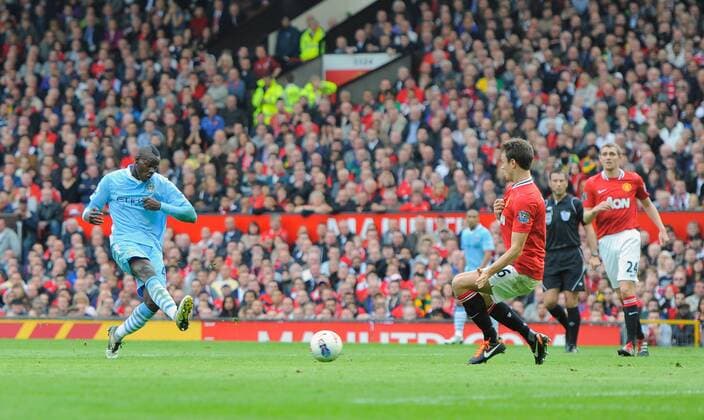 Mario Balotelli of Manchester City scores the first goal Barclays Premier League - Manchester United ManU vs. Manchester City - 23rd October, 2011 EDITORIAL USE ONLY. No use with unauthorised audio, video, data, fixture lists, club league logos or live services. Online in-match use limited to 120 images, no video emulation. No use in betting, games or single club league player publications.