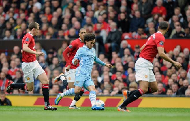 David Silva of Manchester City tries to ghost past Darren Fletcher of Manchester United, Chris Smaling of Manchester United and Rio Ferdinand of Manchester United Barclays Premier League Manchester United v Manchester City 23rd October, 2011 EDITORIAL USE ONLY. No use with unauthorised audio, video, data, fixture lists, club league logos or live services. Online in-match use limited to 120 images, no video emulation. No use in betting, games or single club league player publications. o0 ManU