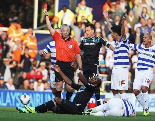 Didier Drogba of Chelsea FC London gets a straight red card for this tackle against Adel Taarabt Barclays Premier League Queens Park Rangers v Chelsea FC London 23rd October, 2011 EDITORIAL USE ONLY. No use with unauthorised audio, video, data, fixture lists, club league logos or live services. Online in-match use limited to 120 images, no video emulation. No use in betting, games or single club league player publications. QPR