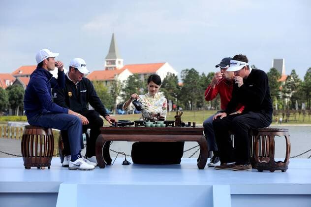 (From left) Golfers Charl Schwartzel of South Africa, Lee Westwood of Britain, Paul Casey of Britain and Keegan Bradley of the United States attend a traditional Chinese tea ceremony during a press conference for the forthcoming Lake Malaren Shanghai Masters golf tournament in Shanghai, China, 25 October 2011.  20111025_37656