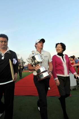 Rory McIlroy of Northern Ireland, center, holds his champion trophy during the award ceremony after the final round of the Lake Malaren Shanghai Masters golf tournament in Shanghai, China, 30 October 2011. McIlroy had led the 30-strong field from the opening day, but a wayward final round saw him having to dig deep to card a level par 72 to finish on a 72-hole total of 288 (-18). Rory McIlroy $2m richer after China victory  20111030_95065 o0 Mc Ilroy Nordirland