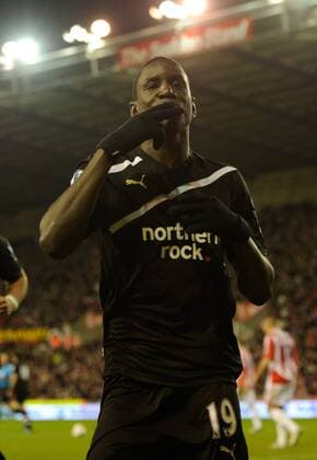 Demba Ba of Newcastle United celebrates scoring from the penalty spot, Stoke City - Newcastle United, Stoke on Trent EDITORIAL USE ONLY. No use with unauthorised audio, video, data, fixture lists, club league logos or live services. Online in-match use limited to 120 images, no video emulation. No use in betting, games or single club league player publications.