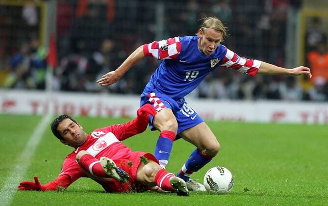 UEFA Euro 2012 play off first leg match between Turkey and Croatia ( blue)at Turk Telekom Arena Stadium in Istanbul, Turkey 11.11.2011 Match scored: Turkey 0 - Croatia 3 Pictured: Arda Turan of Turkey and Domagoj Vida of Croatia. 