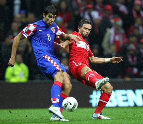 UEFA Euro 2012 play off first leg match between Turkey and Croatia ( blue)at Turk Telekom Arena Stadium in Istanbul, Turkey 11.11.2011 Match scored: Turkey 0 - Croatia 3 Pictured: Vedran Corluka of Croatia and Gökhan Gönul of Turkey. 