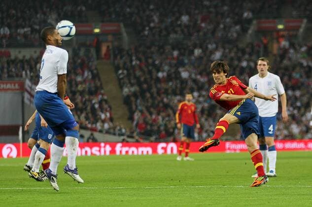 Spains David Silva fires in a shot that hits England Glen Johnson in the face International Friendly England v Spain 12th November, 2011 EDITORIAL USE ONLY. No use with unauthorised audio, video, data, fixture lists, club league logos or live services. Online in-match use limited to 120 images, no video emulation. No use in betting, games or single club league player publications.